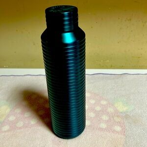 Green Starbucks thermos for hot and cold beverages